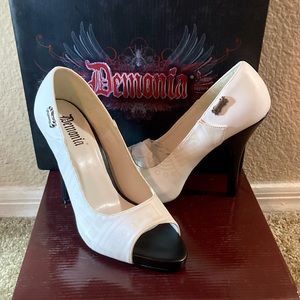 Never worn. Black and white heels